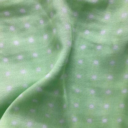 white polka dots green viscose muslin fabric