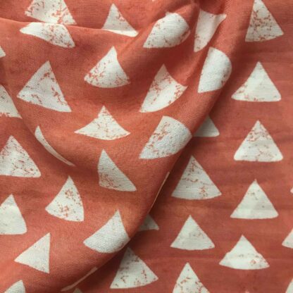 white triangles rust orange viscose muslin fabric