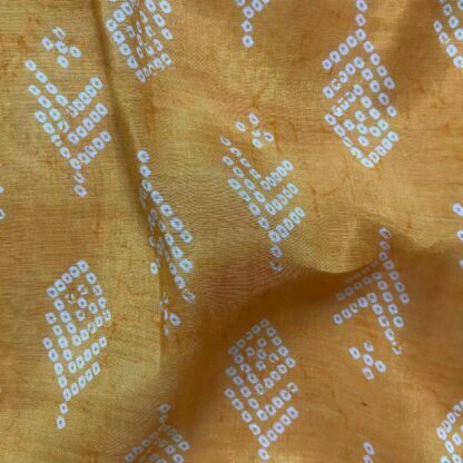 white dots orange yellow viscose muslin fabric