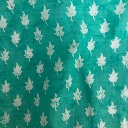 white leaves teal blue viscose muslin fabric