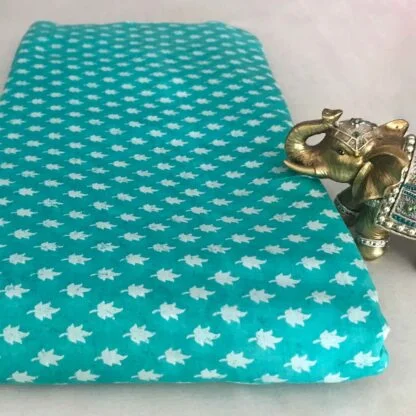 white leaves teal blue viscose muslin fabric
